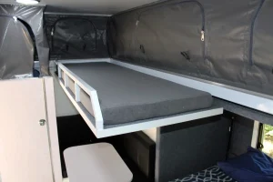 Fold-away top bunk