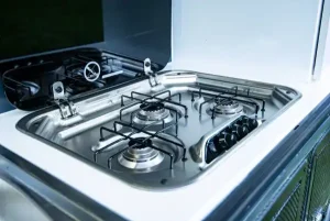 Inbuilt Dometic stainless steel three-burner stove