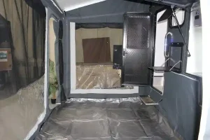 Roll out awning with enclosed walls and floor