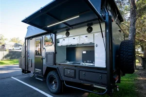 Always ready outdoor kitchen with top-hinged door