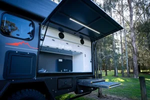 Always ready outdoor kitchen with top-hinged door