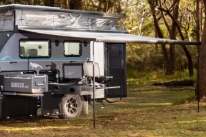 Electric pop-top rollout awning for quick setup