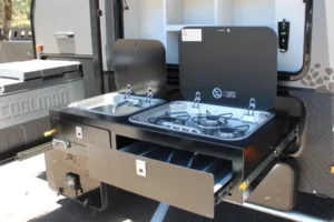 Outdoor kitchen with sink and three-burner stove